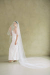 Bride wears ALEXA II two-tier plain veil made by Madame Tulle