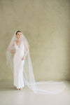 Bride wears ALEXA II two-tier plain veil made by Madame Tulle