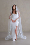 Model wears a lace wedding veil, one tier veil with lace trim.