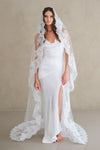 Model wears a lace wedding veil, Mantilla veil with lace trim.