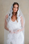 Model wears a lace wedding veil, Mantilla veil with lace trim.